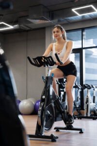 person doing indoor cycling